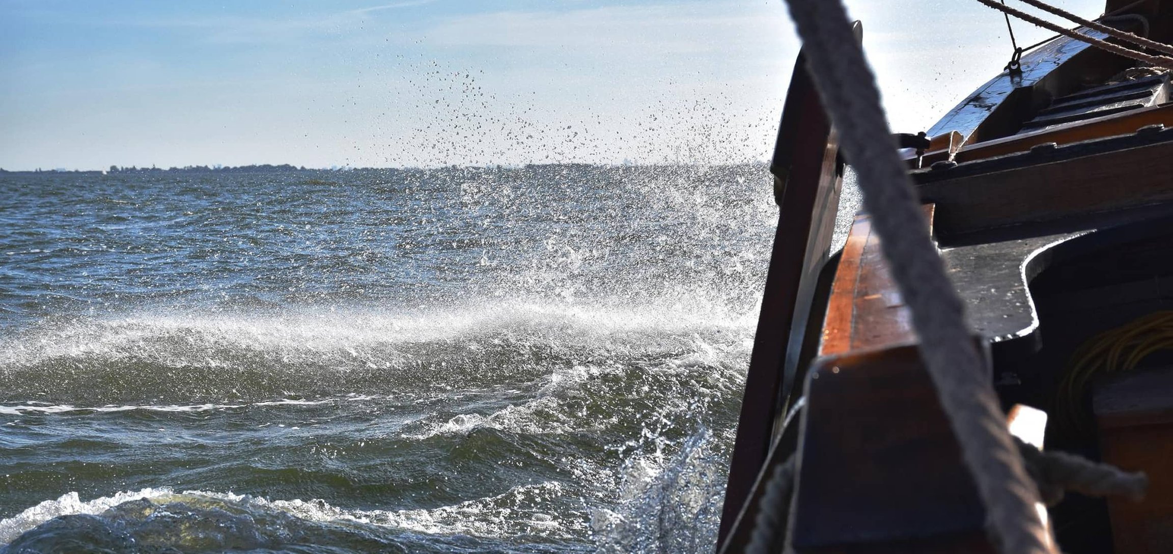 sailboat on rough waters
