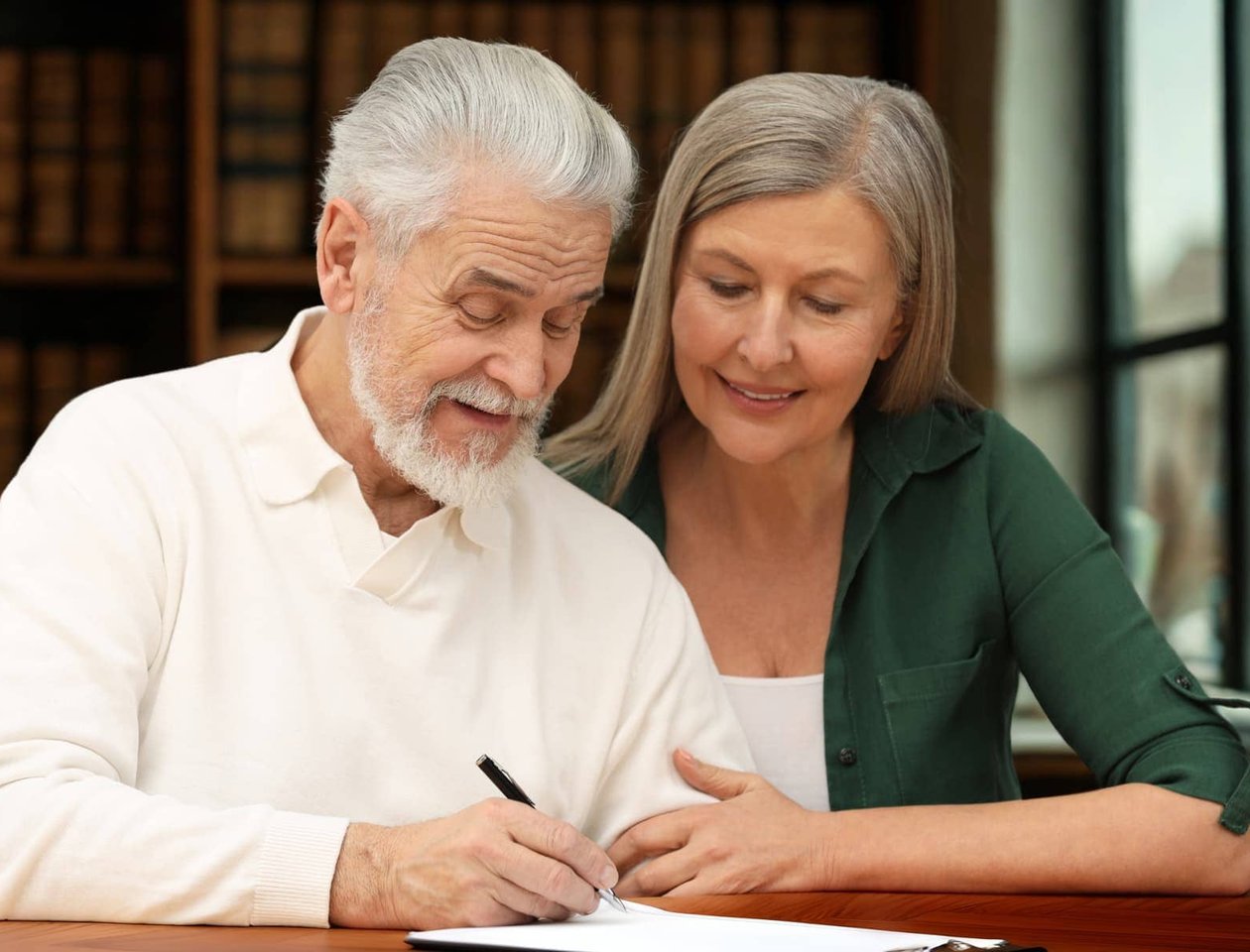 older seniors signing documents