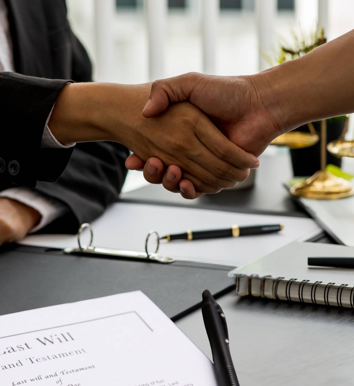 handshake over documents